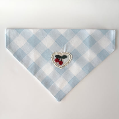 Medium size light blue and white checkered cotton bandana with a heart design featuring cherries on a white background