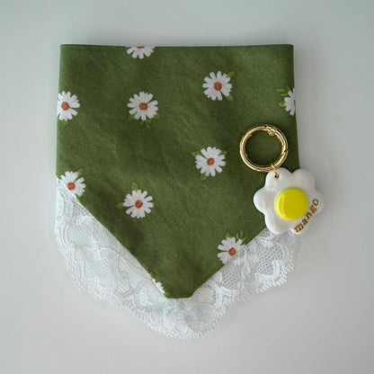 Green bandana with white daisy pattern and lace trim with a daisy matching id tag on a white background